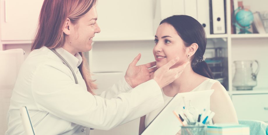 Young woman receiving consultation from a female doctor in a hospital