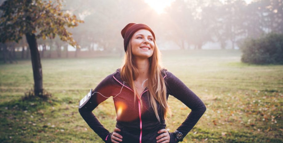 Young woman outside on a sunny autumn day.