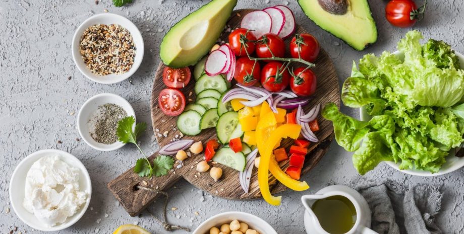 Ingredients for spring vegetable salad. Delicious healthy food. On a gray background, top view