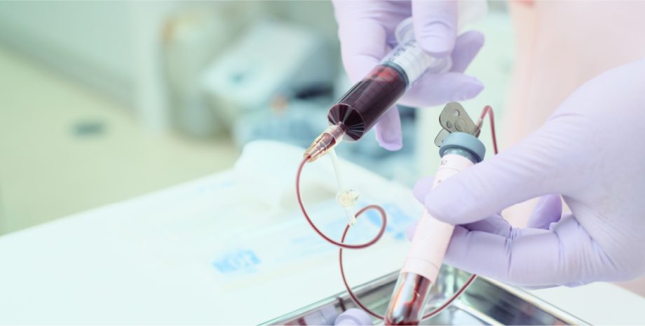 An up close shot of someone drawing blood.