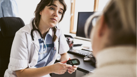 Female doctor talking to a patient in medical clinic