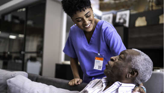 female nurse taking care of a senior man at home